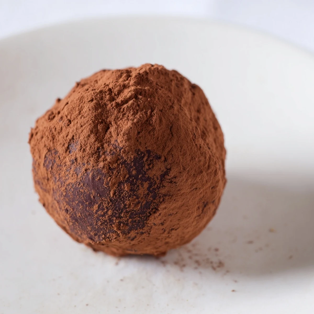 Creamy chocolate truffles, beautifully coated, ready to be enjoyed as bite-sized French dessert.