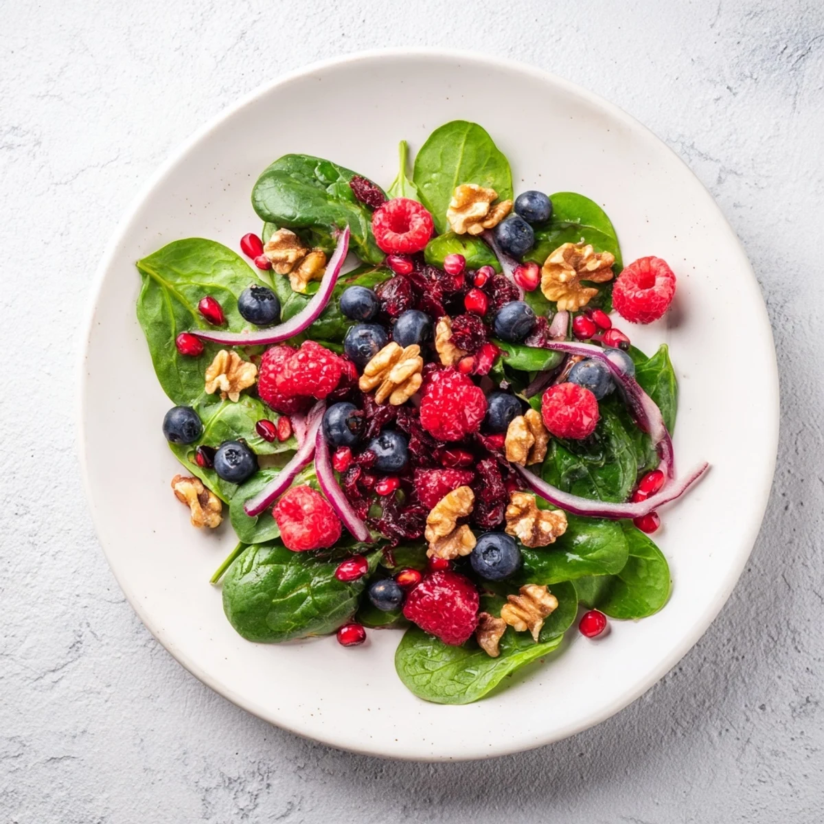 Tender spinach and juicy berries star in this refreshing Winter Berry and Spinach Salad, tossed with crunchy nuts.