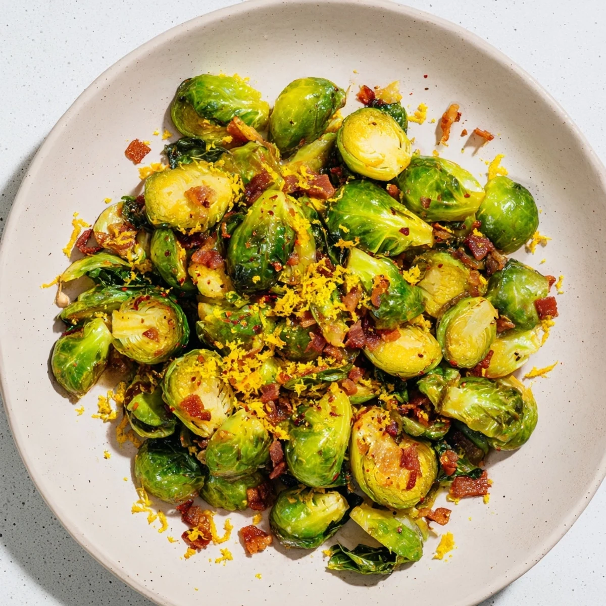 Skillet of savory Brussels sprouts with beef bacon, boasting a smoky, delicious aroma for dinner tonight.