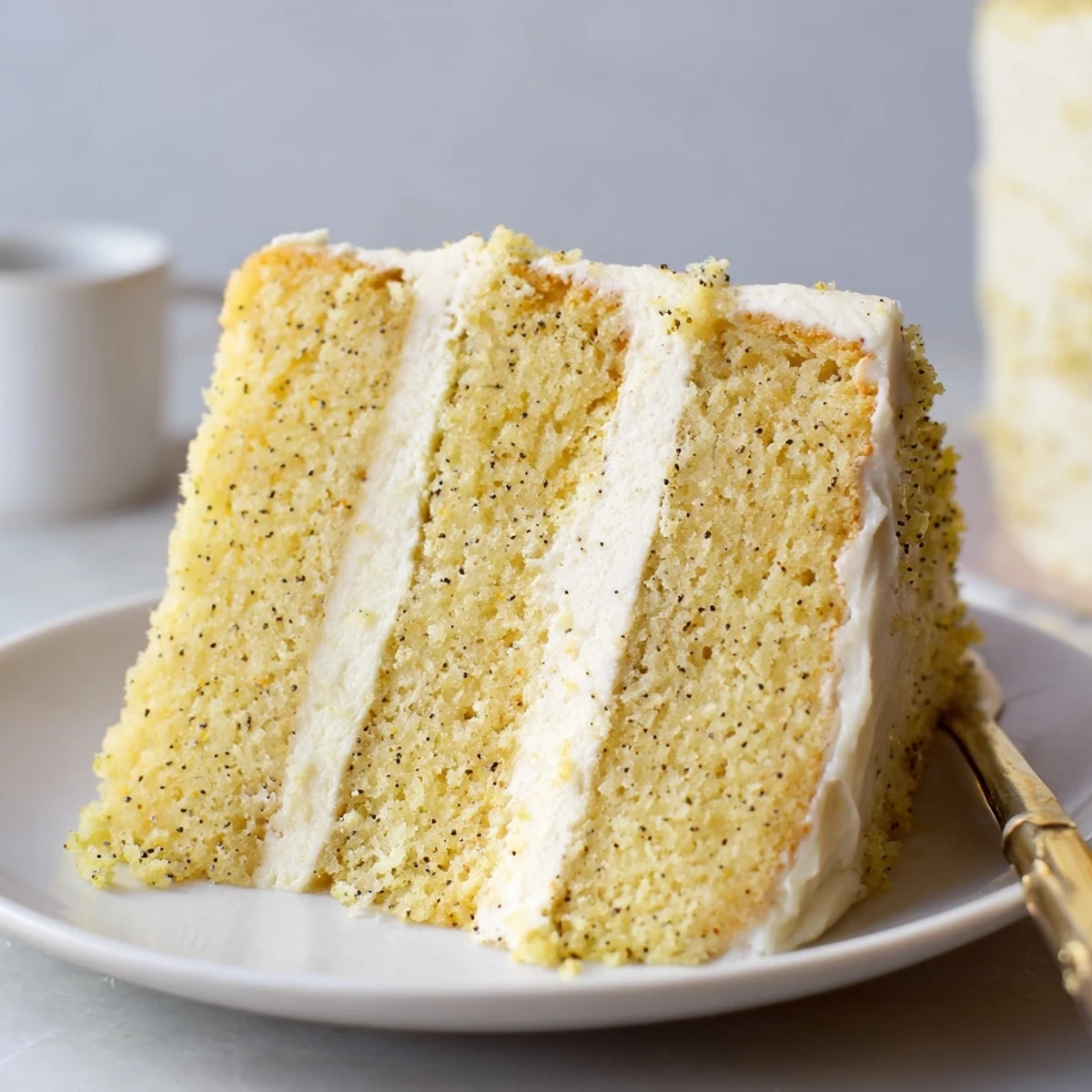 Vanilla bean birthday cake with buttercream frosting featuring speckled vanilla layers and creamy white frosting