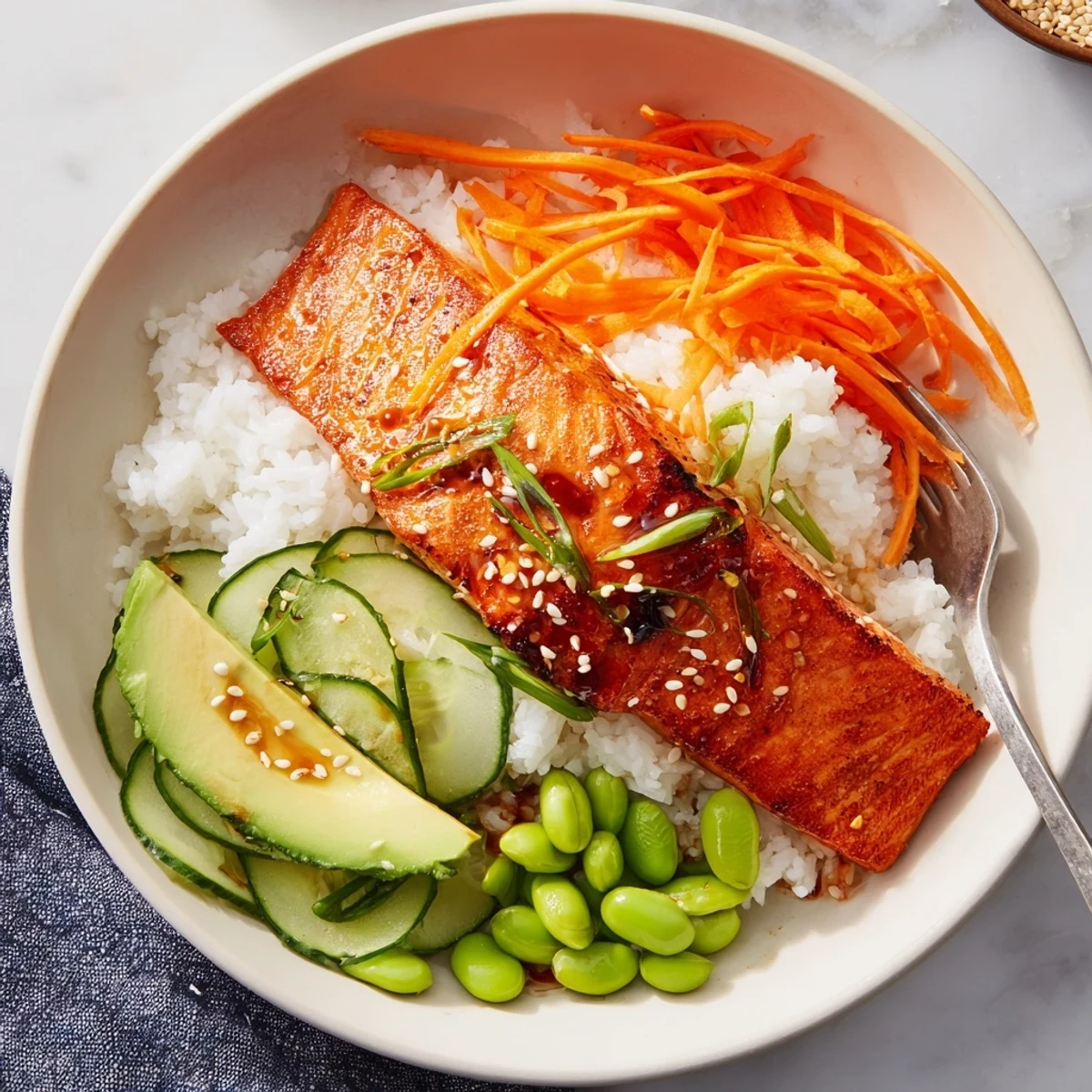Crispy Salmon And Rice Bowl with golden skin, fluffy rice, bright vegetables