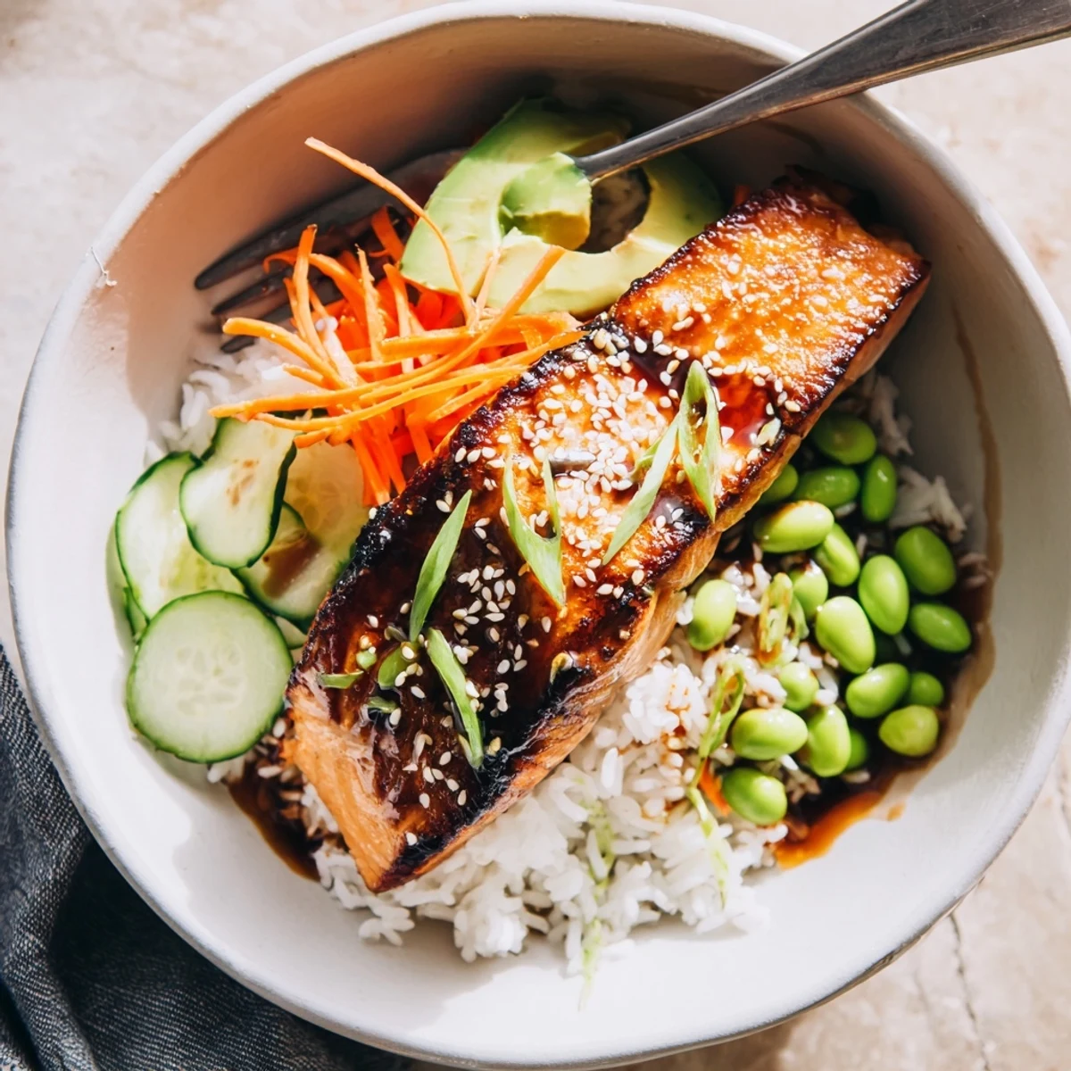 Serve Crispy Salmon And Rice Bowl warm, drizzled with tangy ginger soy sauce