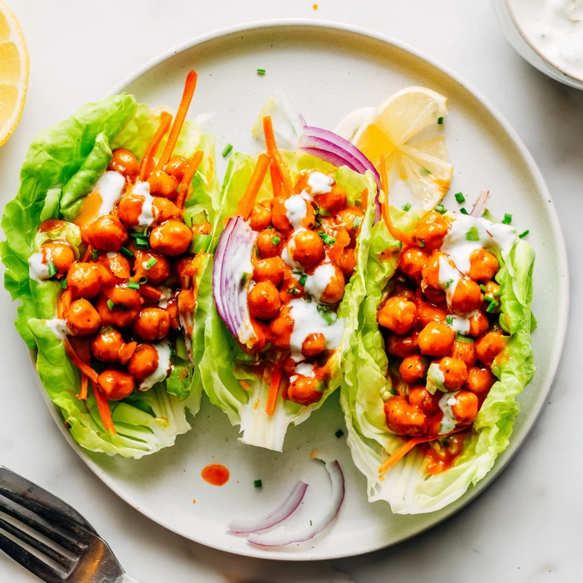 Serve Buffalo Chickpea Lettuce Wraps warm, crisp leaves cradling spicy chickpeas