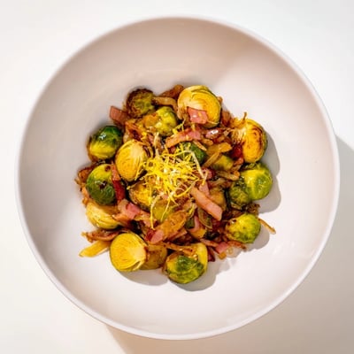 Smoky turkey bacon crisped with caramelized Sautéed Brussels Sprouts offers a flavorful, healthy meal.