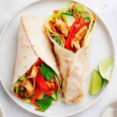 Fresh tortilla roll stuffed with marinated sweet chili chicken strips and crunchy vegetable medley